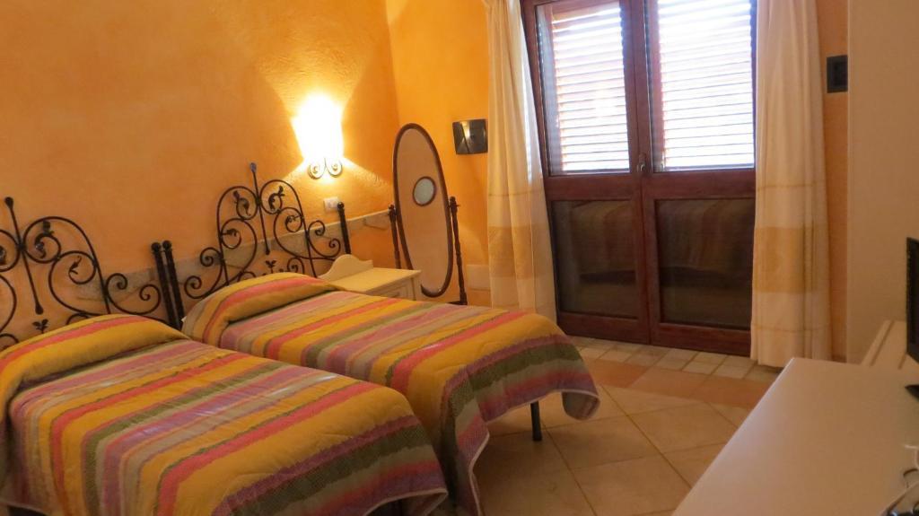Il Viandante Otel San Teodoro  Oda fotoğraf